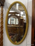(WALL) OVAL WALL MIRROR; GOLD TONED OVAL MIRROR WITH A DETAILED INNER RIM. MEASURES 20.5