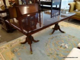 (R1) DOUBLE PEDESTAL DINING TABLE; CHERRY DINING TABLE WITH ROUNDED CORNERS, A DOUBLE PEDESTAL BASE,