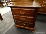 (R2) CHERRY NIGHTSTAND; 3-DRAWER, CHIPPENDALE STYLE NIGHTSTAND WITH BRASS BATWING PULLS. DRAWERS ARE