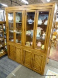 (R2) OAK CHINA CABINET; TOP PIECE HAS 4 BEVELED GLASS DOORS REVEALING 2 SEPERATE AREAS WITH 2