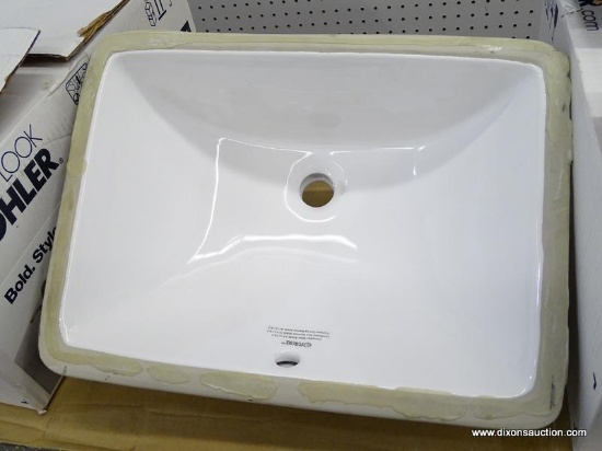 (R1) BATHROOM SINK; WHITE RECTANGULAR UNDERMOUNT BATHROOM SINK. HAS GLUE AROUND THE EDGES. MEASURES