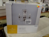 (R6) PORTFOLIO OPULA 4-LIGHT BRUSHED NICKEL TRADITIONAL CLEAR GLASS CHANDELIER; MODEL #0568672.