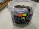 (R5) EXOTIC FIRE GLASS BLACK LAVA ROCKS; IN ORIGINAL CONTAINER WHICH IS BROKEN.