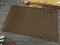 (R6) 5' X 2-1/2' BROWN CRISS CROSS PATTERNED FLOOR MAT. RUBBER BOTTOM FOR BETTER TRACTION. DOES