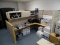 (OFC2) L SHAPED DOUBLE SIDED CUBICLE DESK. NATURAL COLORED WOOD WITH BEIGE FABRIC PANELS. CAN BE