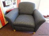 (OFC1) MCM STYLE GREY UPHOLSTERED ARM CHAIRS WITH BLACK PATTERN AND TAPERED NATURAL WOOD GRAIN FEET.