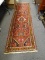 (LEFT WALL) ORIENTAL RUNNER; HAND WOVEN ORIENTAL HAMADAN RUG IN RED, BROWN AND IVORY- 31 IN X 112 IN