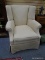 (LEFT WALL) WING CHAIR; MAHOGANY QUEEN ANNE WING CHAIR WITH BEIGE UPHOLSTERY- 32 IN X 39 IN X 39 IN