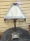 (LEFT WALL) ANTIQUE LAMP; ANTIQUE MISSION DESIGNED SLAG GLASS LAMP WITH BEADED TASSELS- GLASS IN