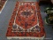 (LEFT WALL) ORIENTAL RUG; HANDWOVEN HAMADAN ORIENTAL RUG IN RED, IVORY AND BLUE- ONE END MISSING