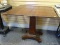 (LEFT WALL) EMPIRE GAME TABLE; 19TH CEN. MAHOGANY EMPIRE GAME TABLE RESTING ON PEDESTAL BASE WITH