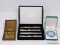 (LEFT WALL) MISC.. LOT; LOT INCLUDES 4 BOMBAY SILVER PLATED CHEESE KNIVES IN VELVET BOX, WEDGEWOOD