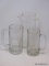 (LEFT WALL) GLASS LOT; PITCHER- 11 IN. H. AND 2 MUGS- 7 IN AND 8 IN