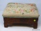 (R1) EMPIRE FOOTSTOOL; ANTIQUE MAHOGANY EMPIRE FOOTSTOOL WITH CREWEL WORK UPHOLSTERY- 16 IN X 12 IN