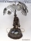 (R1) ANTIQUE LAMP; ANTIQUE SMELTER LAMP OF MIDDLE EASTERN WATER CARRIER, PALM TREE OVER MAN CARRYING