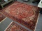 (R1) ORIENTAL RUG; HANDWOVEN PERSIAN RUG IN FLORAL GEOMETRIC PATTERNS IN RED, BLUE AND IVORY- 99 IN