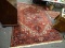 (R1) ORIENTAL RUG; HAND WOVEN PERSIAN RUG IN FLORAL GEOMETRIC PATTERNS IN RED IVORY AND BROWN- 78 IN