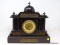 (R2) ANTIQUE MANTEL CLOCK; ANTIQUE SLATE AND BRASS ARCHITECTURAL MANTEL CLOCK, BRASS FACE AND FRIEZE