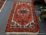 (LEFT WALL) ORIENTAL RUG; HANDWOVEN HAMADAN ORIENTAL RUG IN RED, IVORY AND BLUE- ONE END MISSING