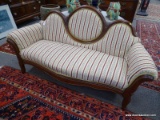 (R1) VICTORIAN SETTEE; WALNUT VICTORIAN CAMEO BACK SETTEE WITH INCISED CARVED KNEES AND NEWLY FLORAL