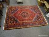 (R1) ORIENTAL RUG; HAND WOVEN PERSIAN ORIENTAL RUG IN GEOMETRIC PATTERNS IN BLUE, RED AND ORANGE- 62