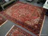 (R1) ORIENTAL RUG; HANDWOVEN PERSIAN RUG IN FLORAL GEOMETRIC PATTERNS IN RED, BLUE AND IVORY- 99 IN