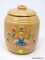 (RIGHT WALL) VINTAGE COOKIE JAR; VINTAGE UNMARKED POTTERY COOKIE JAR WITH EMBOSSED GIRL- 9 IN H