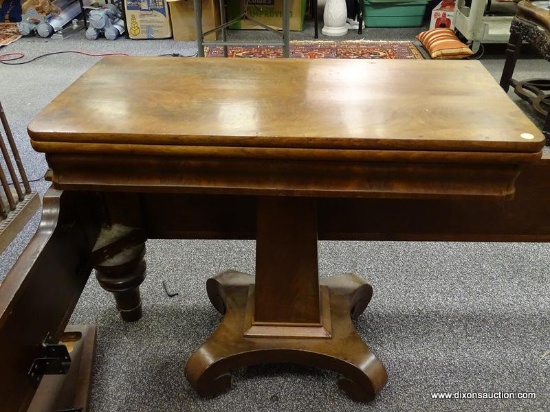 (R2) EMPIRE GAME TABLE; 19TH CEN. MAHOGANY EMPIRE GAME TABLE ON PEDESTAL BASE WITH C SCROLL FEET-