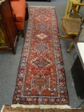 (R2) ORIENTAL RUNNER; HAND WOVEN PERSIAN ORIENTAL RUNNER IN RED, IVORY AND BLUE- 29 IN X 106 IN