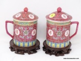 (R2) ORIENTAL MUGS; PR. OF LIDDED ORIENTAL TEA MUGS ON ROSEWOOD STANDS- 7 IN H