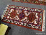 (R2) ORIENTAL RUG; HAND WOVEN THICK PILE TURKOMAN RUG IN RED IVORY AND BLUE GEOMETRIC PATTERNS,