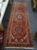 (R2) ORIENTAL RUNNER; HAND WOVEN PERSIAN ORIENTAL RUG IN RED, IVORY AND BLACK WITH LOTUS DESIGN IN