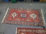 (R2) ORIENTAL RUG; HAND WOVEN TURKOMAN ORIENTAL RUG WITH GEOMETRIC FIGURES IN RED, BLACK AND IVORY (