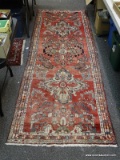 (BACK WALL) ORIENTAL RUNNER; ORIENTAL PERSIAN RUNNER WITH LOTUS PATTERN DESIGN IN RED, IVORY AND