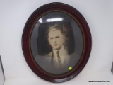 (RIGHT WALL) FRAMED PHOTO; VINTAGE FRAMED PHOTO IN OVAL PAINTED FRAME WITH BUBBLE GLASS- 17 IN X 20