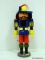 (LWALL) ERZGEBIRGE NUTCRACKER; BLUE AND YELLOW NUTCRACKER WITH A FEATHER HAT. MEASURES 13