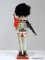 (R4) SOLDIER NUTCRACKER HOLDING A FLAG IN HIS RIGHT HAND - WHITE. MEASURES 15