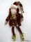 (BR) MARK ROBERTS FAIRY, SMALL; FAIRY IS WEARING A RED COAT WITH A RED AND BROWN PATTERNED