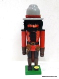 (R4) RANGER NUTCRACKER - RED AND BROWN. MEASURES 10