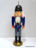 (R4) ERZGEBIRGE WARRIOR NUTCRACKER HOLDING AN AXE IN HIS LEFT HAND - BLUE WITH GRAY PANTS. MEASURES