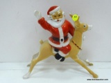 (R3) VINTAGE, PLASTIC, SANTA CLAUS RIDING A REINDEER LAMP. NEEDS TO BE WIRED. MEASURES 10