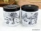 (TABLES) PAIR OF STACKABLE MILK GLASS JARS; HAS A BLACK PAINTED FARM SCENE WITH SCREW ON PLASTIC