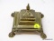 (RFRT) ANTIQUE INK WELL; ANTIQUE BRASS INKWELL RESTING ON PAW FEET WITH PORCELAIN INSERT- 5 IN X 5