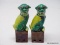 (RFRT) PAIR OF PORCELAIN FOO DOGS; 2 PIECE SET OF YELLOW AND GREEN FOO DOGS SITTING ON A MAROON