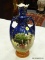 (RFRT) ENGLAND TROPHY URN VASE WITH A PAINTED EARLY EGYPTIAN SCENE, BLUE COLORING AT THE TOP, AND