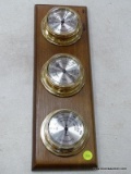 (TABLES) TAYLOR WEATHER STATION WITH A THERMOMETER, A BAROMETER, AND A HUMIDITY GAUGE. MEASURES 5.5