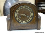 (TABLES) VINTAGE BRITISH MADE, OAK MANTLE CLOCK WITH TIGER'S OAK ACCENTS. CLOCK NEEDS TO BE WOUND