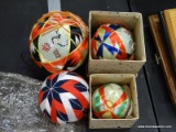 (TABLES) LOT OF FABRIC BALL ORNAMENTS; 4 PIECE LOT TO INCLUDE 3 MATCHING ORIENTAL BALL ORNAMENTS AND