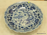 (TABLES) BLUE AND WHITE PORCELAIN, ORIENTAL CHARGER WITH A SCALLOPED RIM. HAS A 17.5
