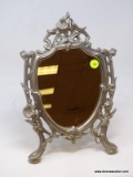 (RFRT) MIRROR; CAST METAL SHIELD STYLE MIRROR WITH FLORAL MOTIF- 9 IN X 12 IN